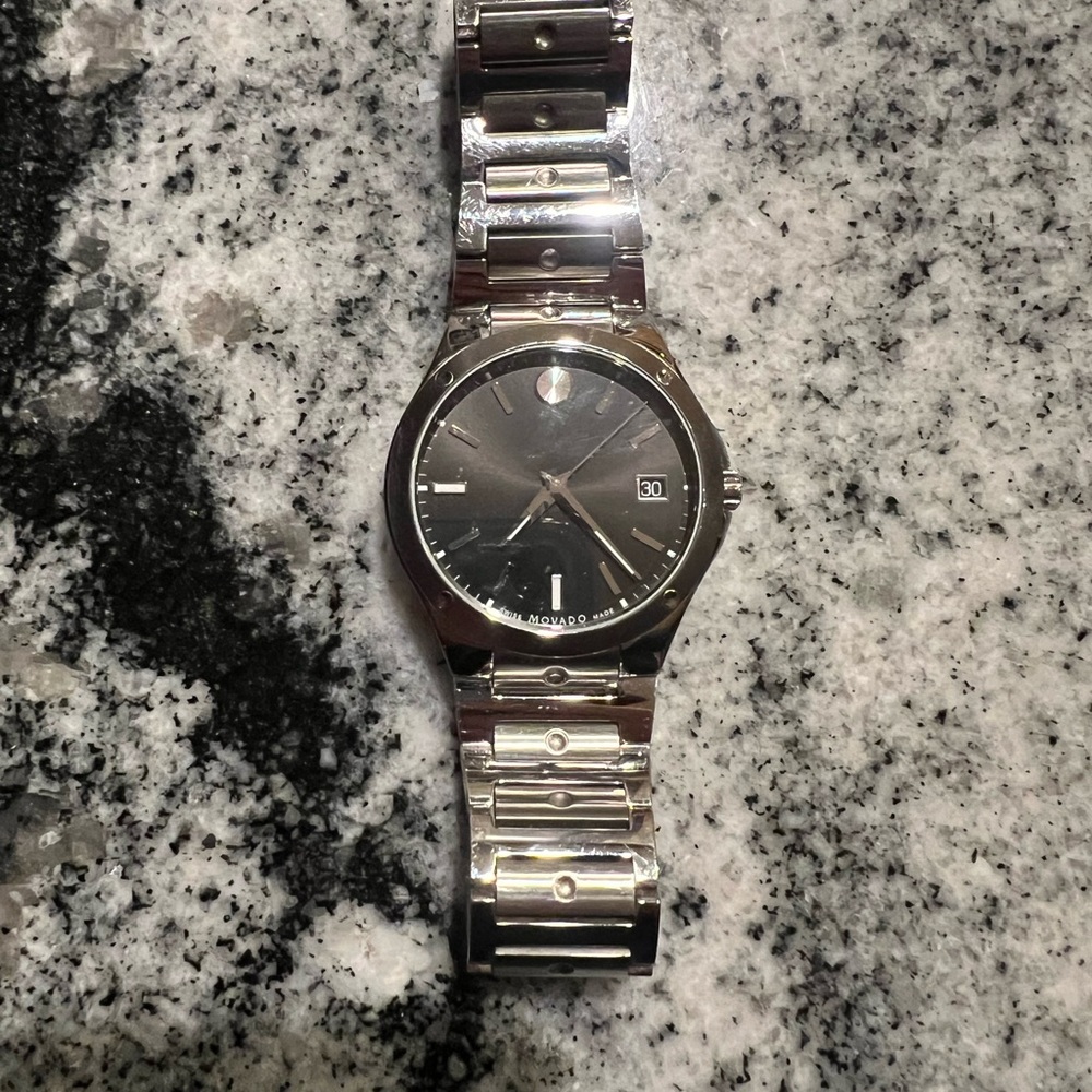 Good condition high end Movado Watch 100% Authentic. Comes with box.